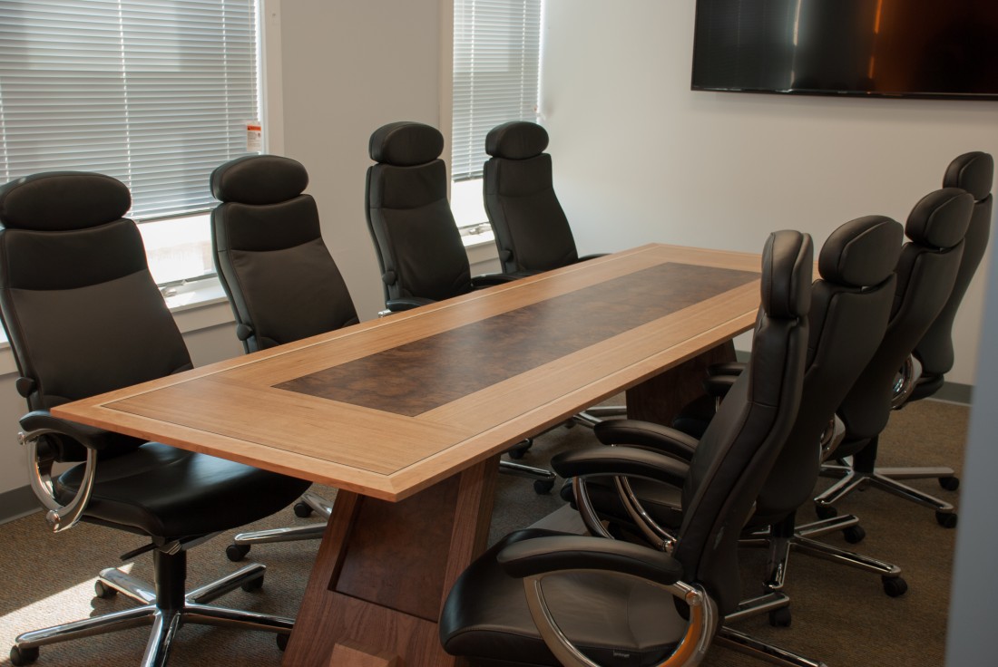 Conference table with chairs around it